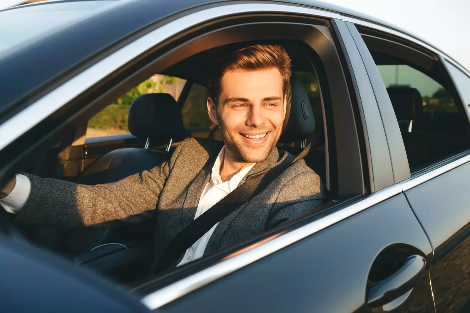 man driving car