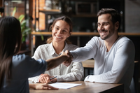 couple shaking agents hand