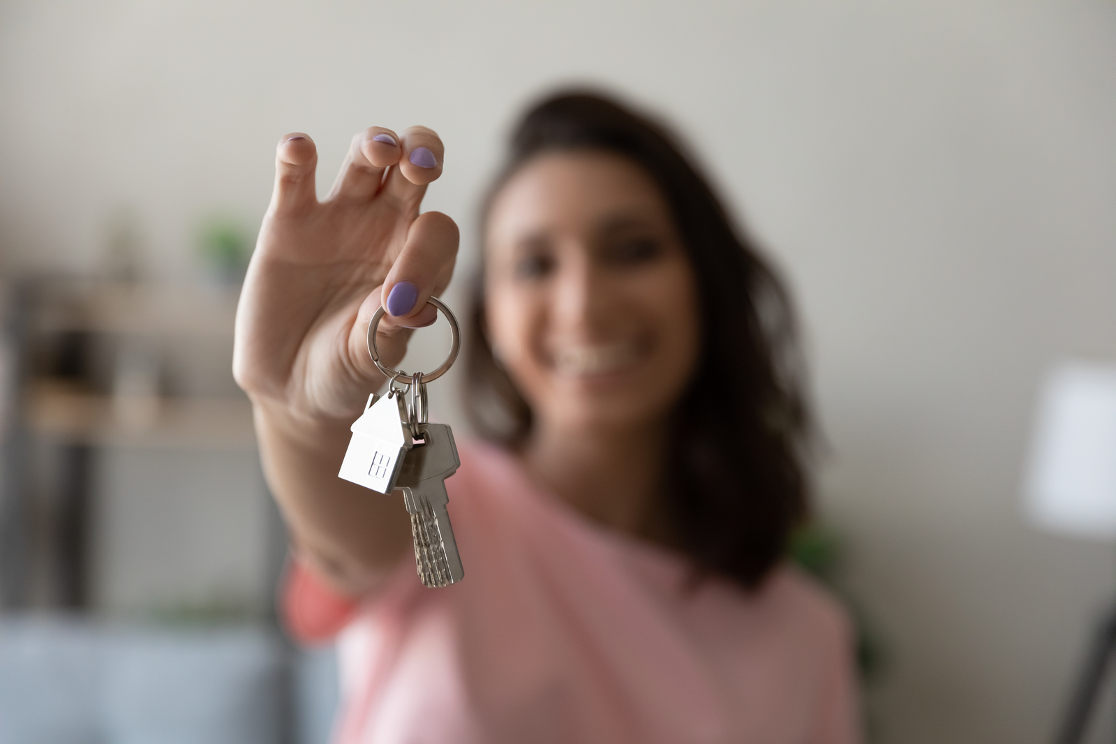 woman holding keys for rental property