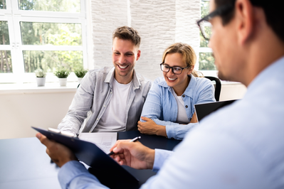 insurance agent assisting couple
