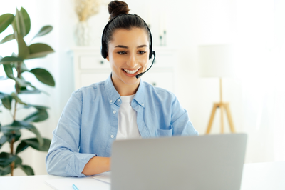 woman on phone and laptop