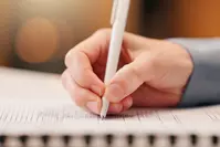 person filling out forms