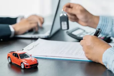 model car and paperwork