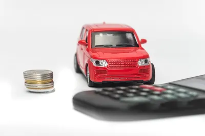 car with coins and calculator
