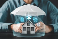 graphic showing house protected by insurance umbrella