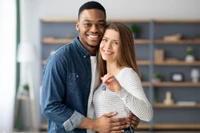 young homeowners with key