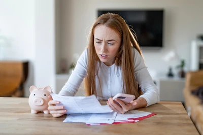 woman looking at high insurance premiums