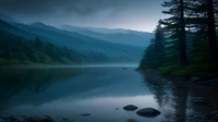 Calm mountain lake at dawn with mist over the water and evergreen trees along the shore, no people, logos, or text